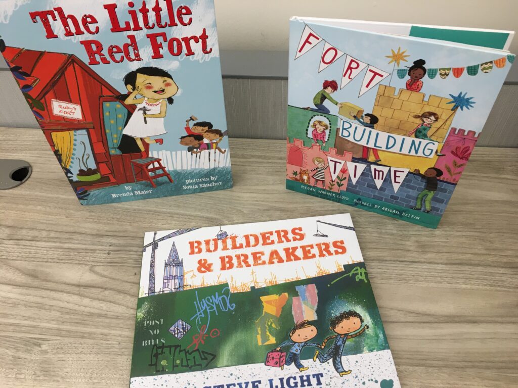 Books on a table: The Little Red Fort; Fort building time; Builders & Breakers