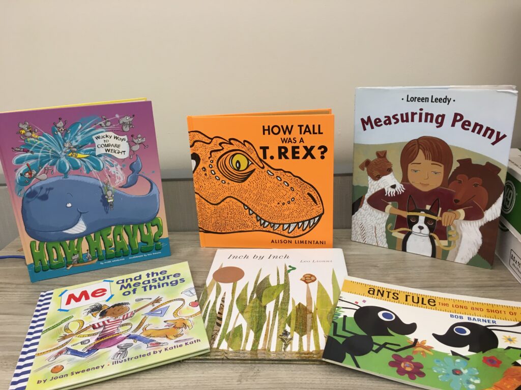 Books on desk: How Heavy?; How Tall Was a T-Rex?; Measuring Penny; Me and the Measure of Things; Inch by Inch; Ants Rule.