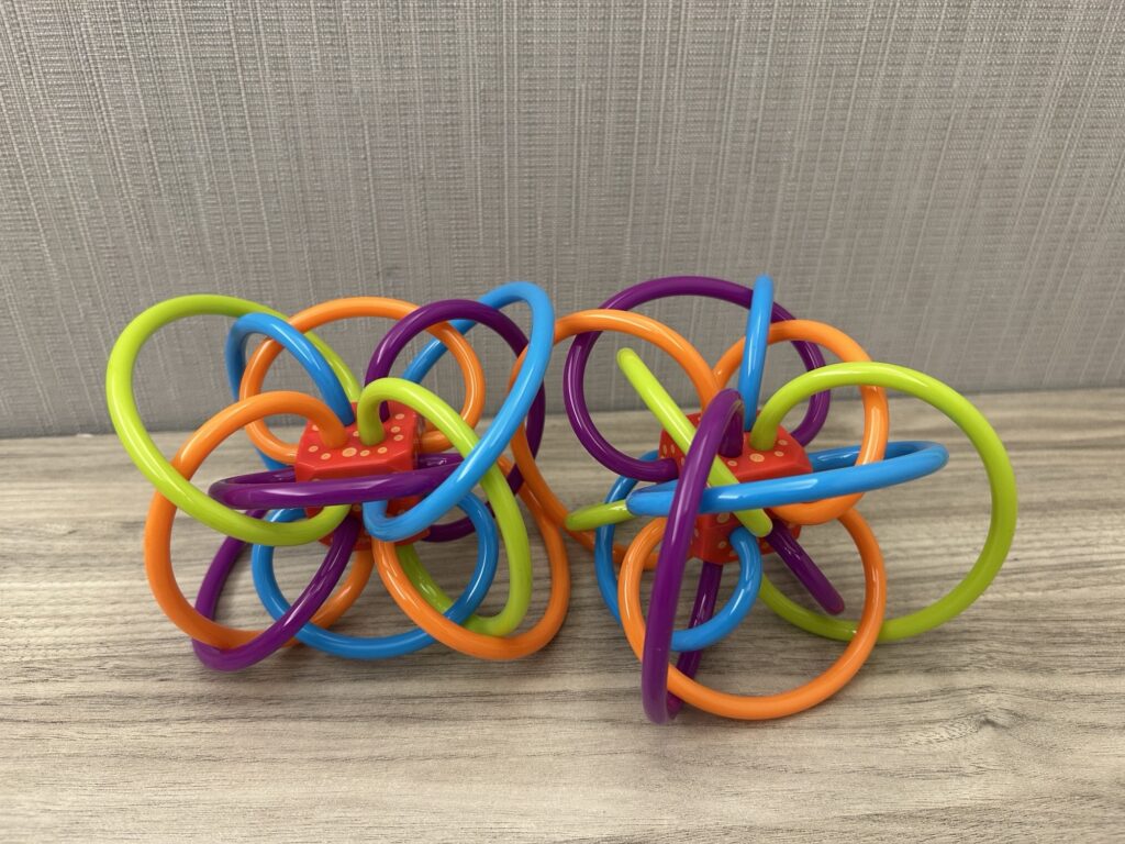 2 Winkel activity toys by Manhattan Toy
