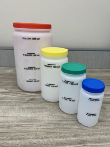 Four containers with colorful lids